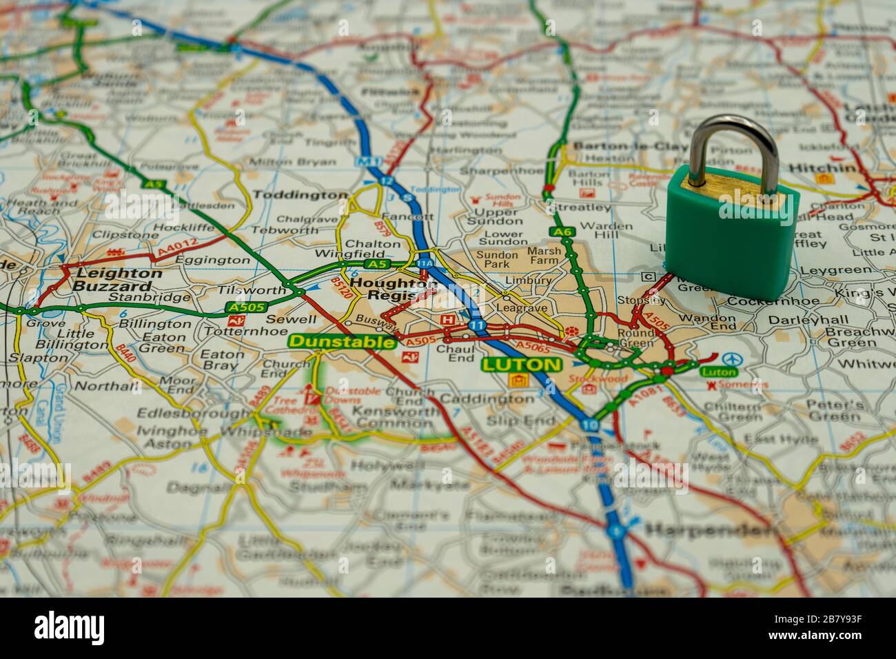 Luton Shown on a road map or geography map with a padlock on top to represent a city in lock down Stock Photo