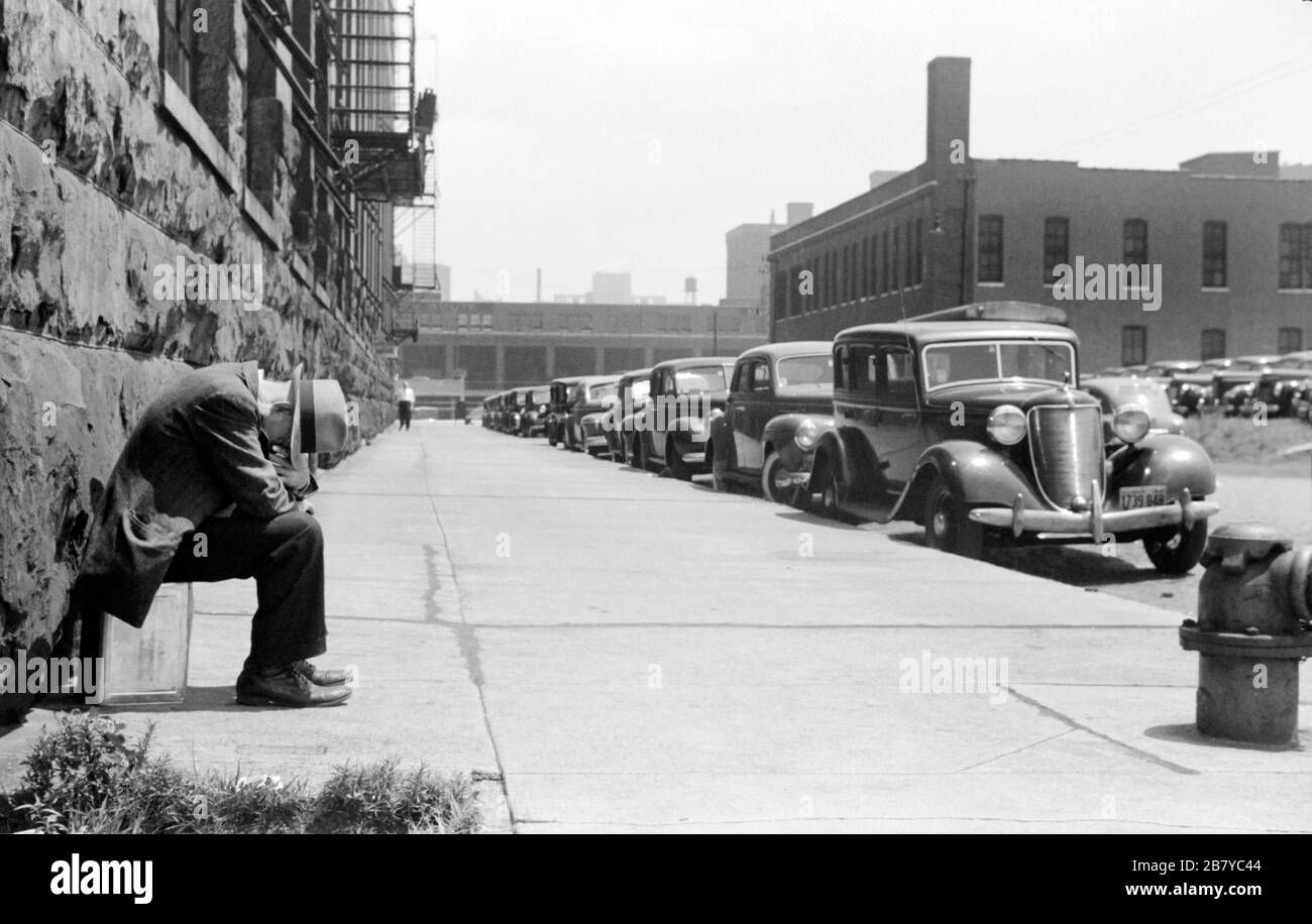 Man seated on Corner of Jefferson Street and Vernon Park Place, Chicago