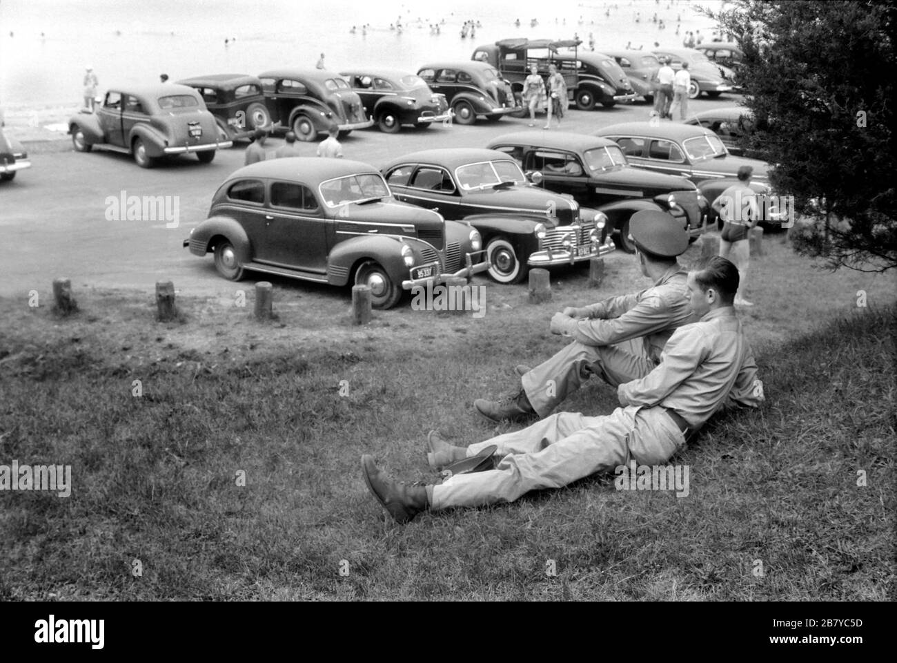 Two Soldiers Watching Beach Crowd, Yorktown, Virginia, USA,  Jack Delano for U.S. Office of War Information, June 1941 Stock Photo