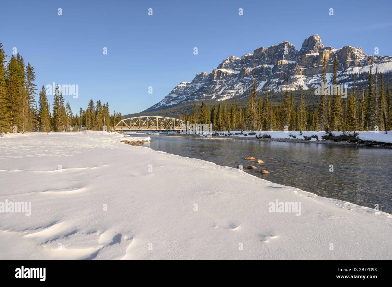 Winter view of the steel truss bridge over the Bow River at Castle Junction in Banff National Park, Alberta, Canada Stock Photo