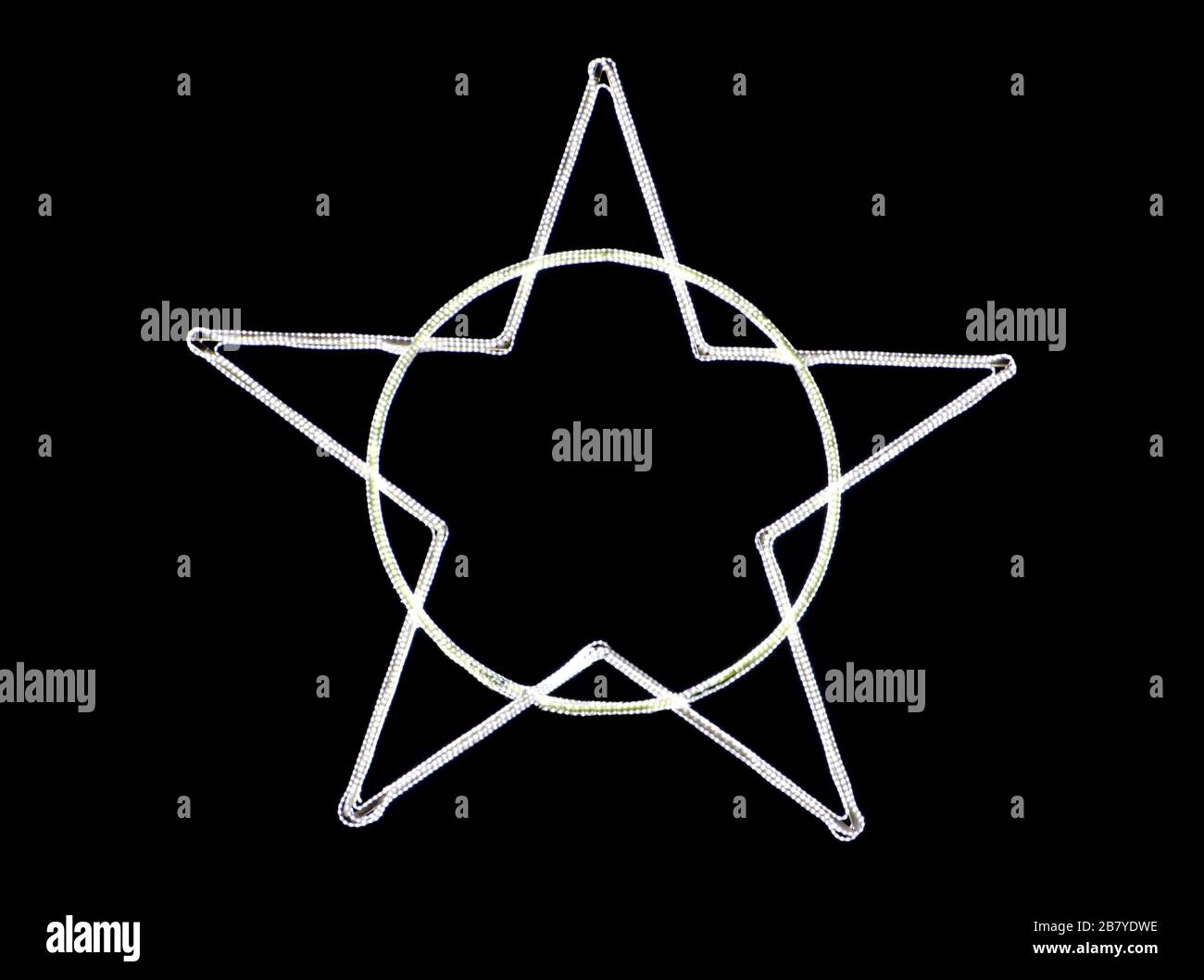 Illuminated star shape on a circle against a black background - cool