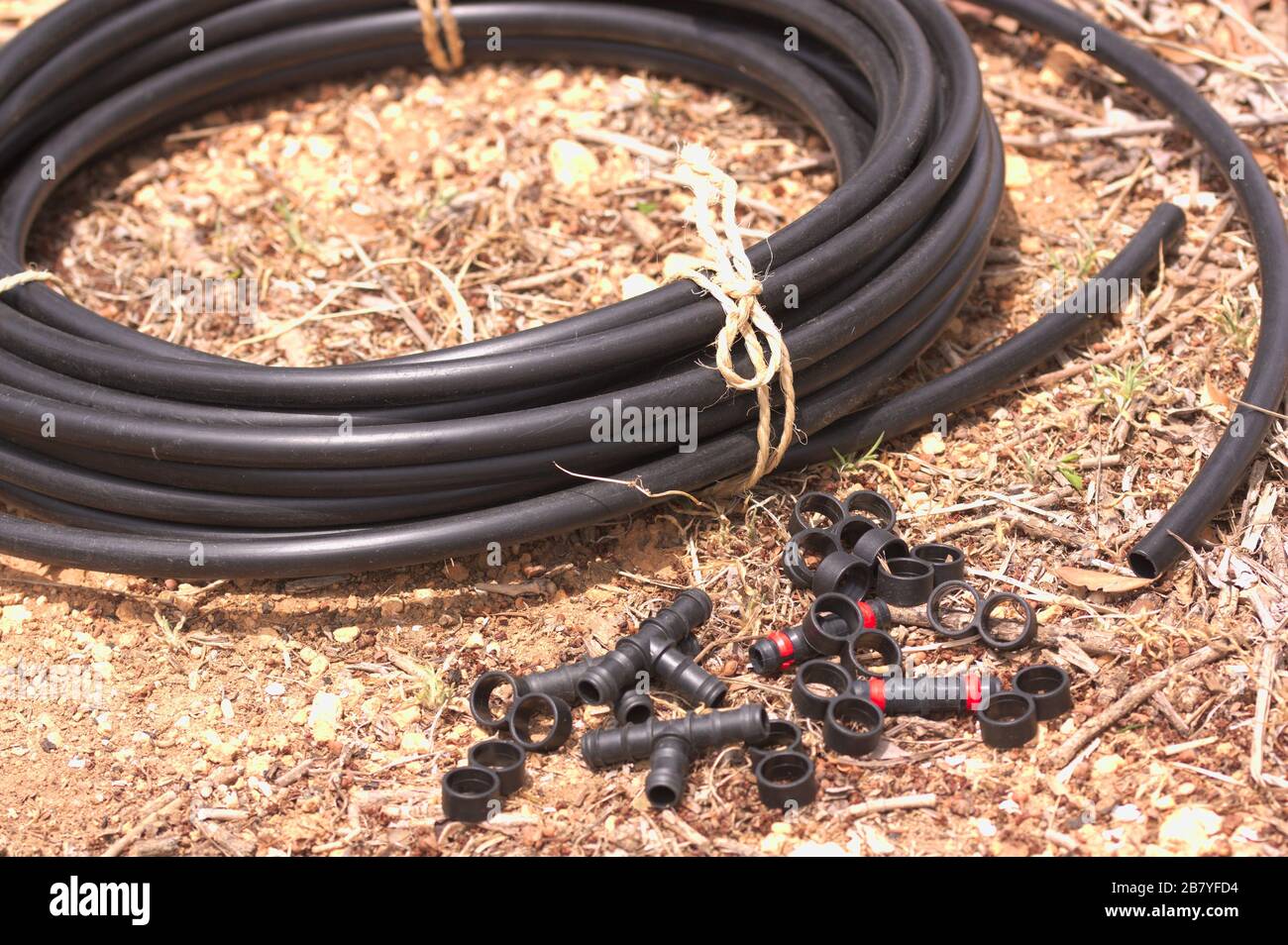 Image of a drip irrigation rubber with some useful accessories for the installation of this
