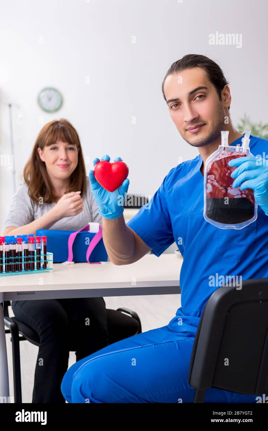 Young woman in the blood transfusion concept Stock Photo Alamy