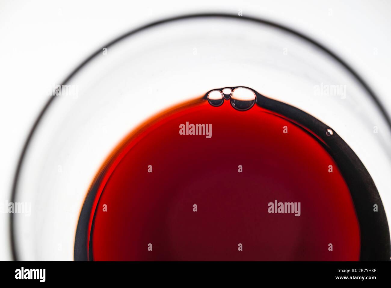 Glass of red wine on white background Stock Photo Alamy