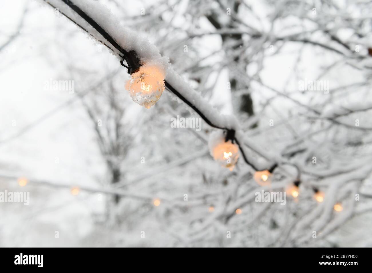 Snow on fairy lights Stock Photo