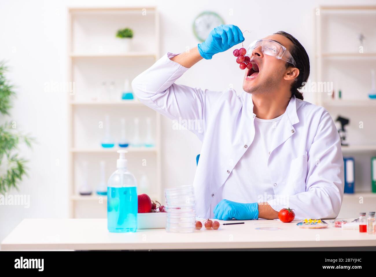 Young nutrition expert testing food products in lab Stock Photo Alamy