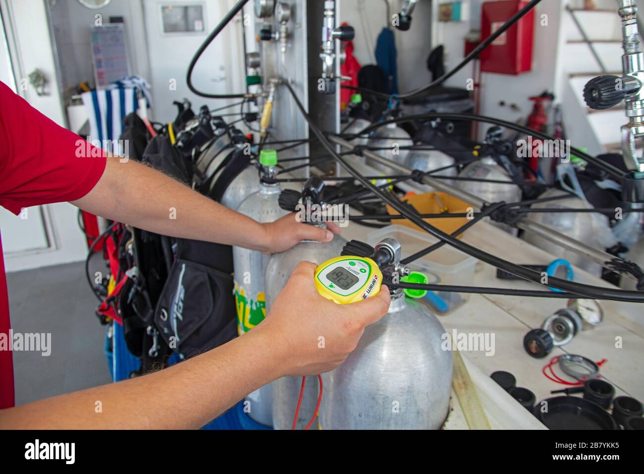 A diver test the percentage in his nitrox cylinder at the filling