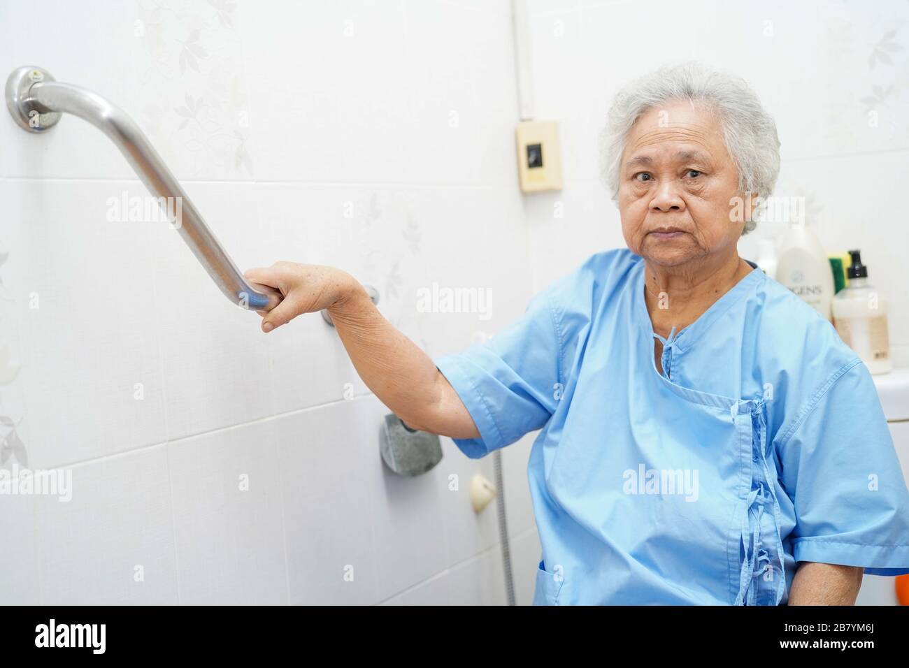 Asian senior or elderly old lady woman patient use toilet bathroom handle  security in nursing hospital ward : healthy strong medical concept Stock  Photo - Alamy