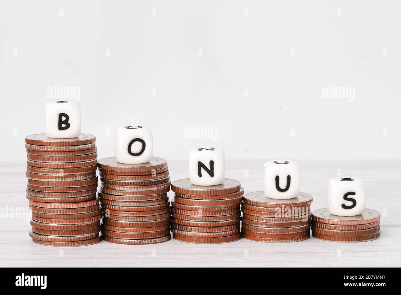 Bonus Alphabet On Stack Of Coins Money More From Salary Payment Income For Office Employee Worker Stock Photo Alamy