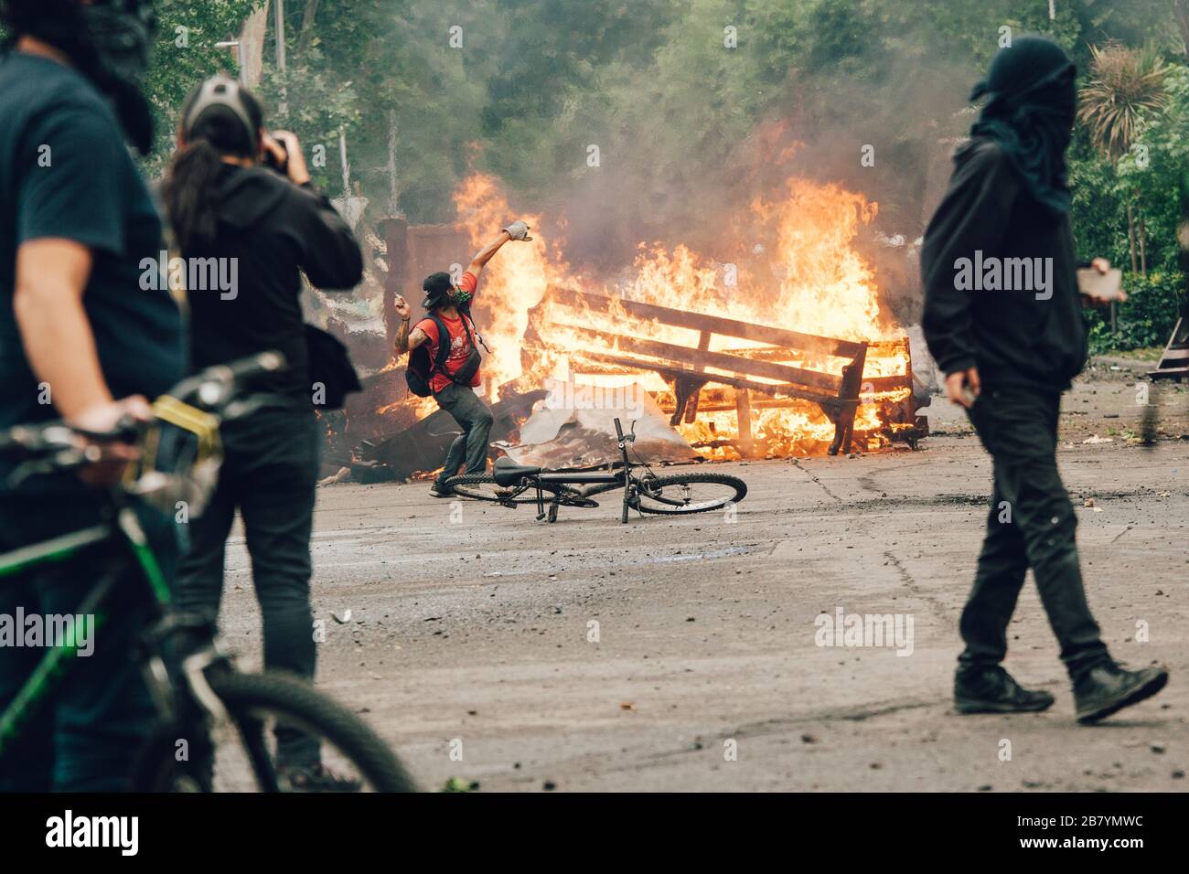 SANTIAGO, CHILE-NOVEMBER 8, 2019 - Protesters barricade with looted furniture from the 'Parroquia de la Asuncion' church during the protests against t Stock Photo