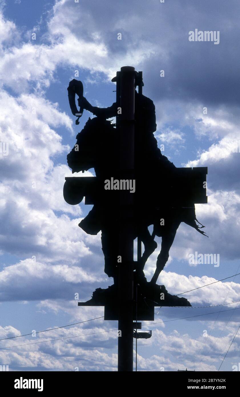 Silhouetted view of cut out billboard of the Marlboro Man cowboy promoting cigarettes on the Sunset Strip in Los Angeles, California circa 1980s. Stock Photo