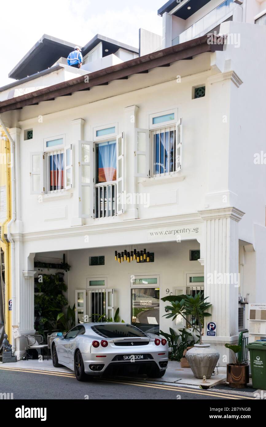 Singapore - July 5th 2019: House with Ferarri car parked outside. There are many wealthy people inthe city. Stock Photo