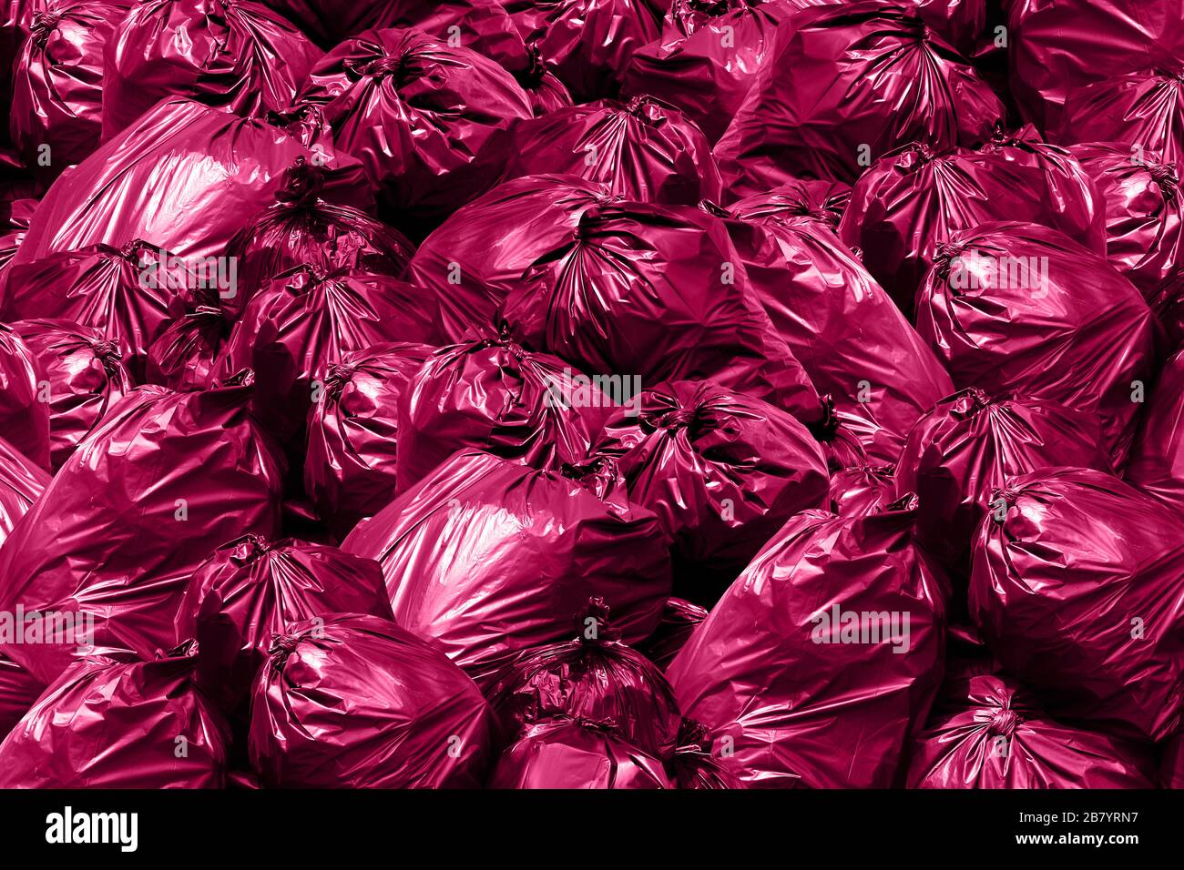 https://c8.alamy.com/comp/2B7YRN7/background-garbage-dump-bintrash-garbage-rubbish-plastic-bags-pile-garbage-bags-pink-purple-2B7YRN7.jpg