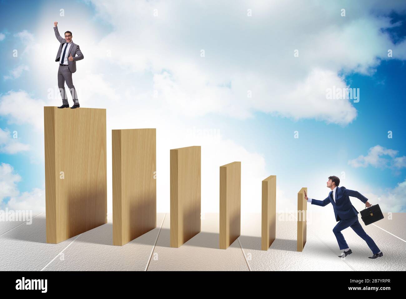 Domino effect and the competition concept Stock Photo - Alamy