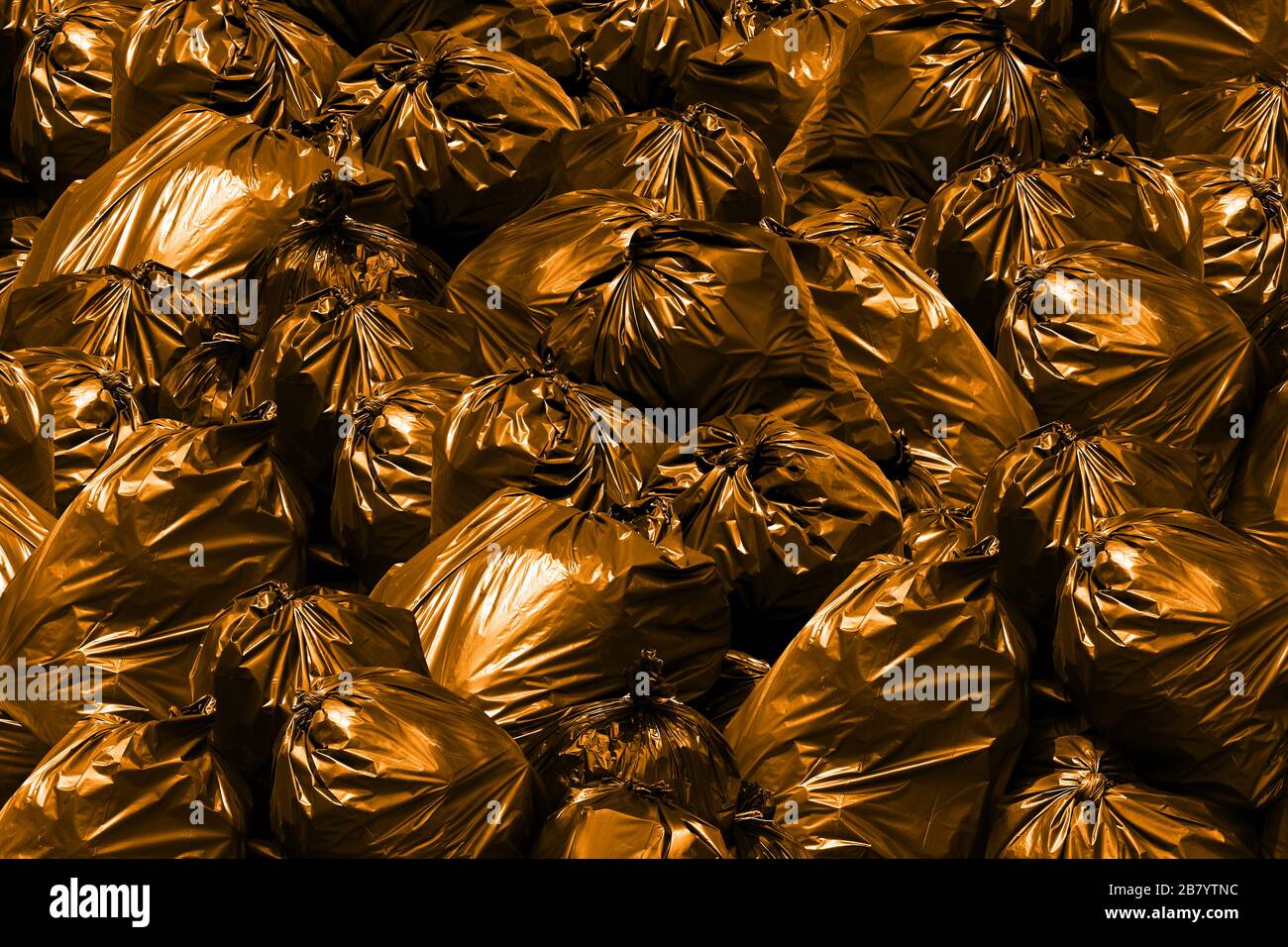 Background pile of garbage bags orange, Bin,Trash, Garbage, Rubbish, Plastic Bags pile Stock