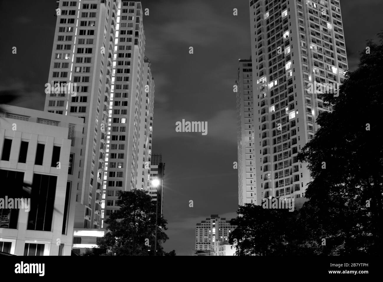 residential buildings twins at night view gray color tone Stock Photo