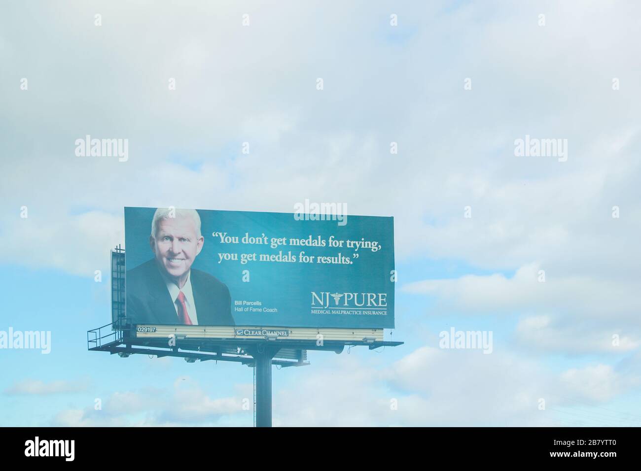 Secaucus, NJ / USA November 28, 2019 :  An advertisement billboard of NJ PURE on highway I-95, NJ PURE is a leading medical malpractice insurer in New Stock Photo
