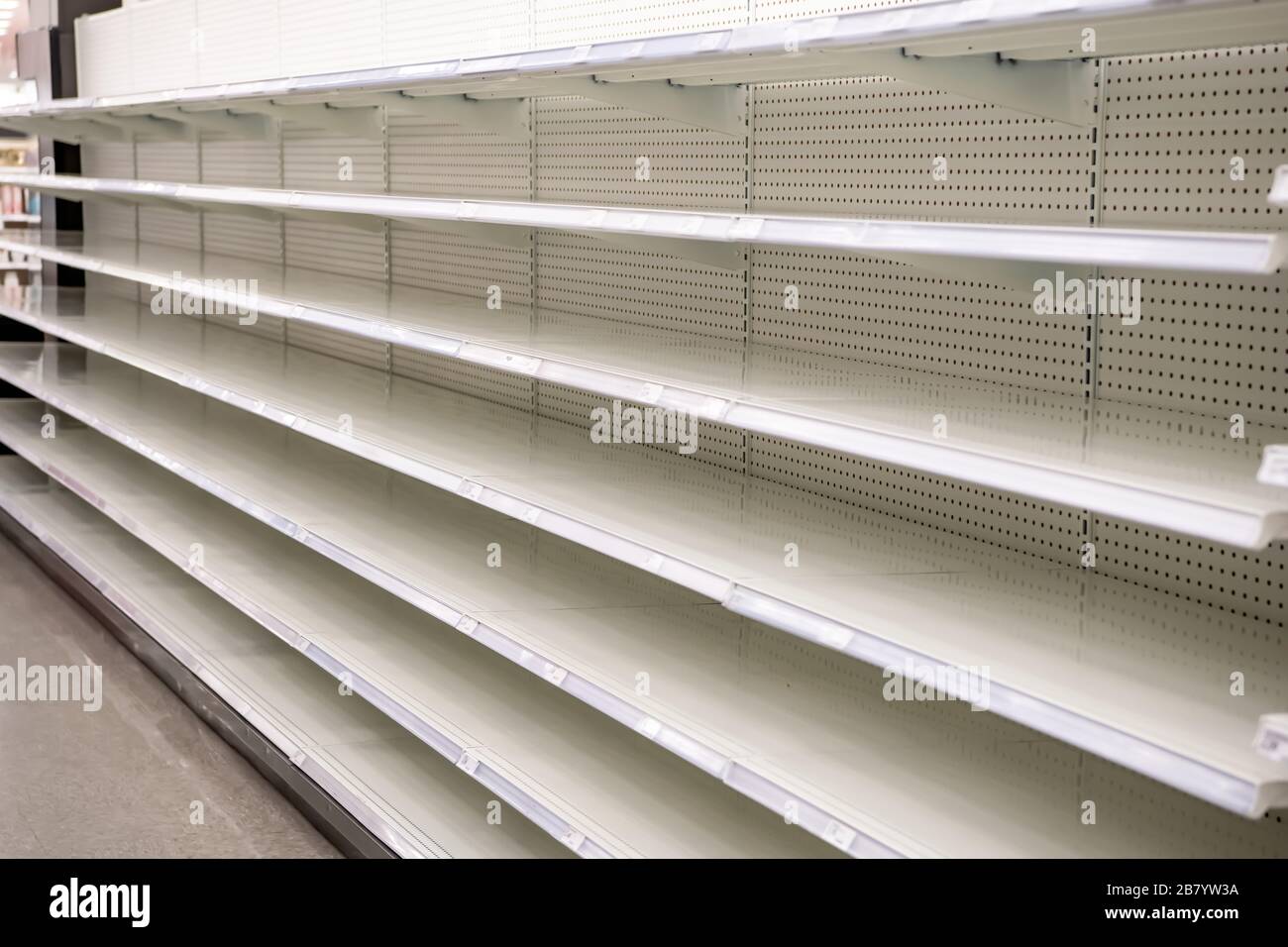 Empty Grocery Store Shelves in a grocery store due to the COVID19
