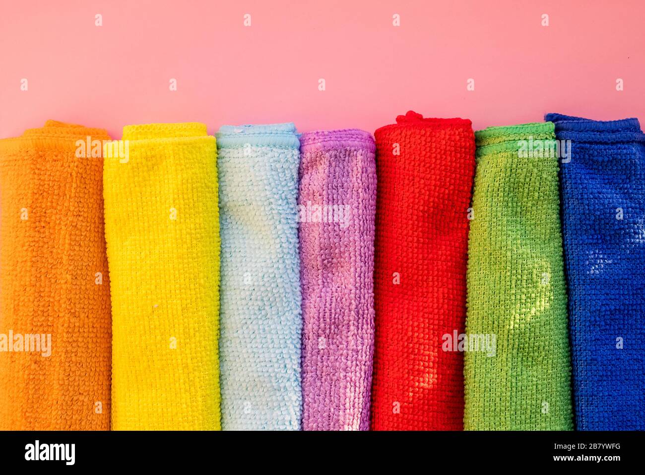 stacked colorful microfiber cleaning cloths on a white background.House