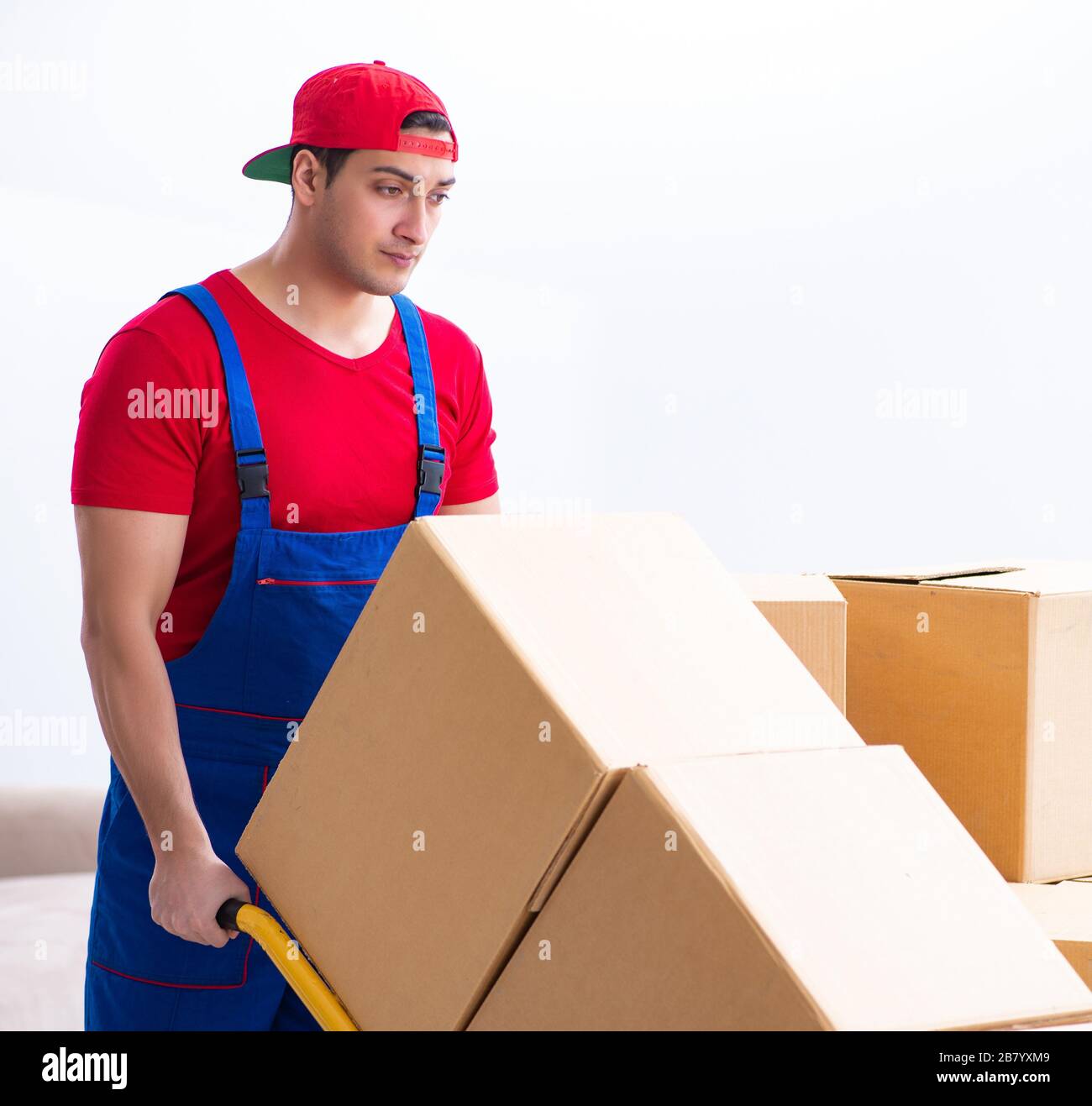 The contractor worker moving boxes during office move Stock Photo - Alamy