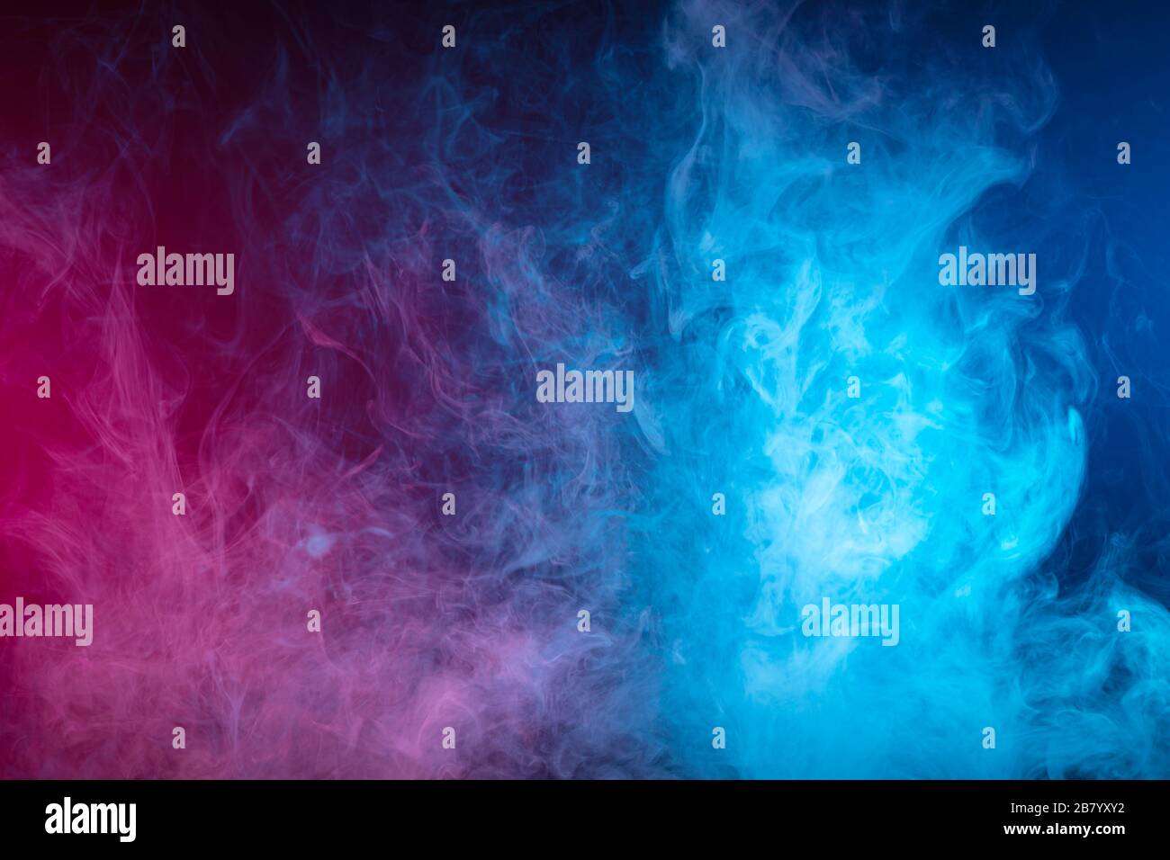 Blue and pink bomb smoke on black isolated background Stock Photo - Alamy