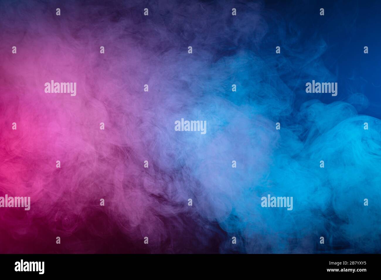 Blue and pink bomb smoke on black isolated background Stock Photo - Alamy
