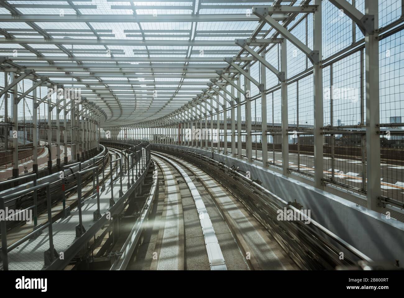 tunnel of monorail road view from front window of a moving train running Stock Photo