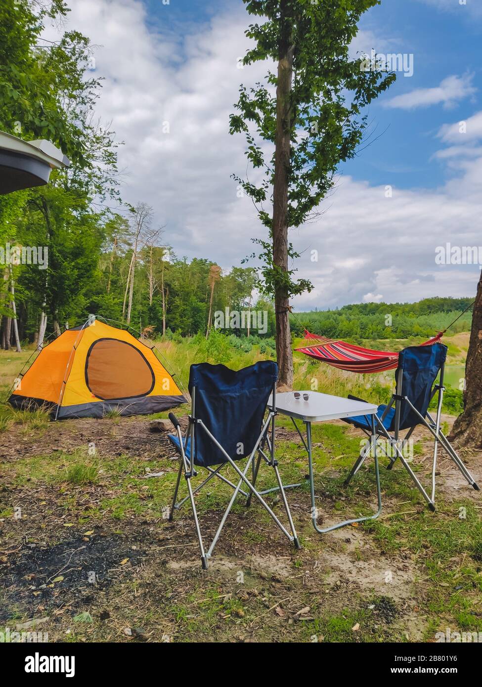 camp at forest hammock with tent and portable chairs Stock Photo Alamy