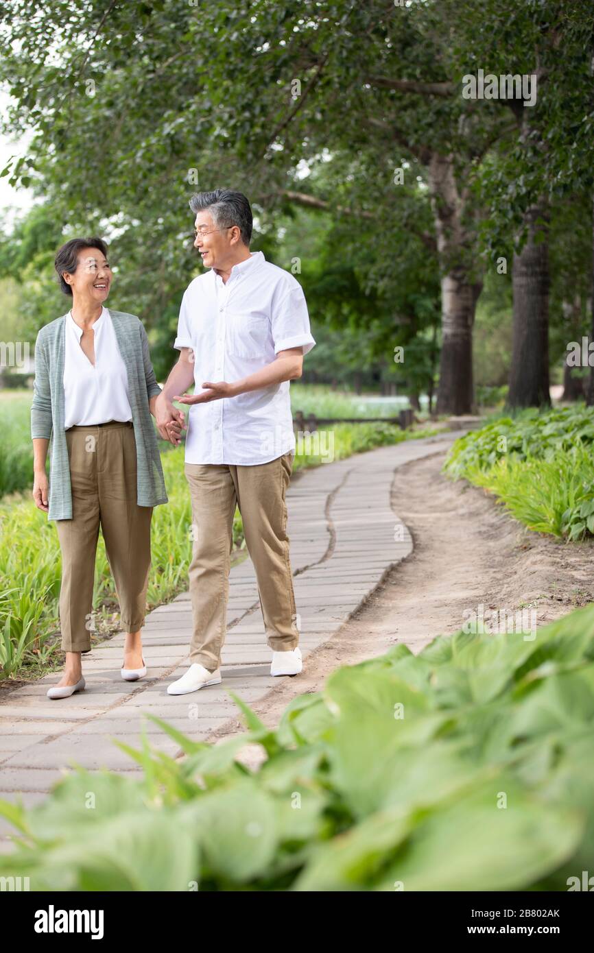 Happy senior chinese couple walking hi-res stock photography and images ...