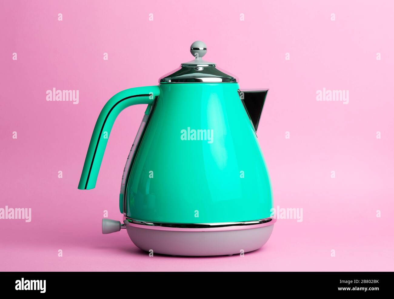 Kettle Background. Electric vintage retro kettle on a colored pink