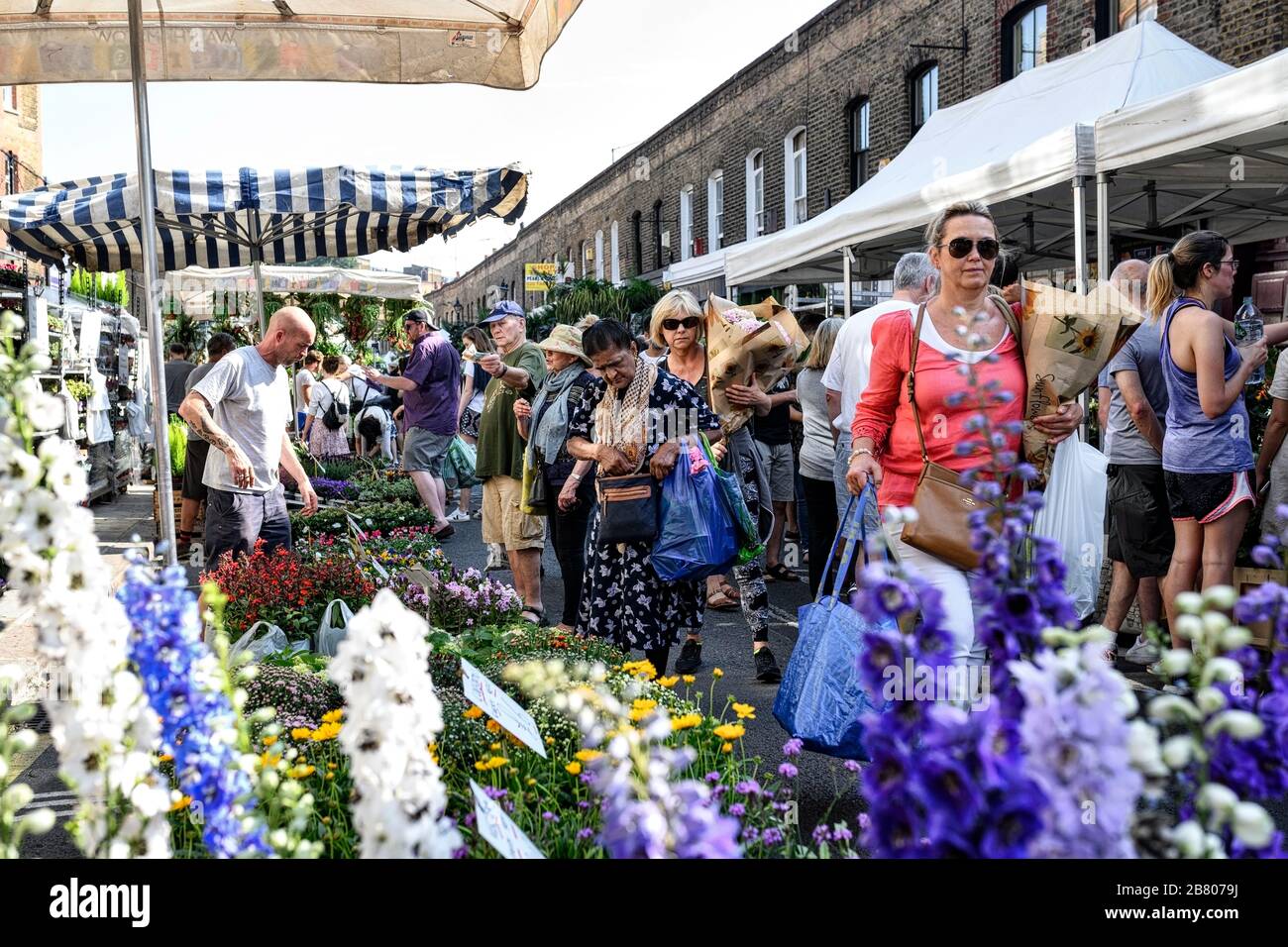 People at the Columbia Road flower market in Bethnal Green in London