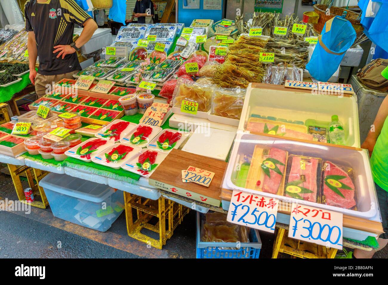 Tokyo, Japan - April 18, 2017: talls selling sashimi and typical products Japanese at Ameya-Yokocho market street near Ueno Station.Ameyoko is a Stock Photo