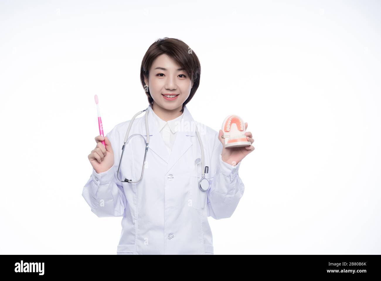 A young Asian woman doctor Stock Photo - Alamy