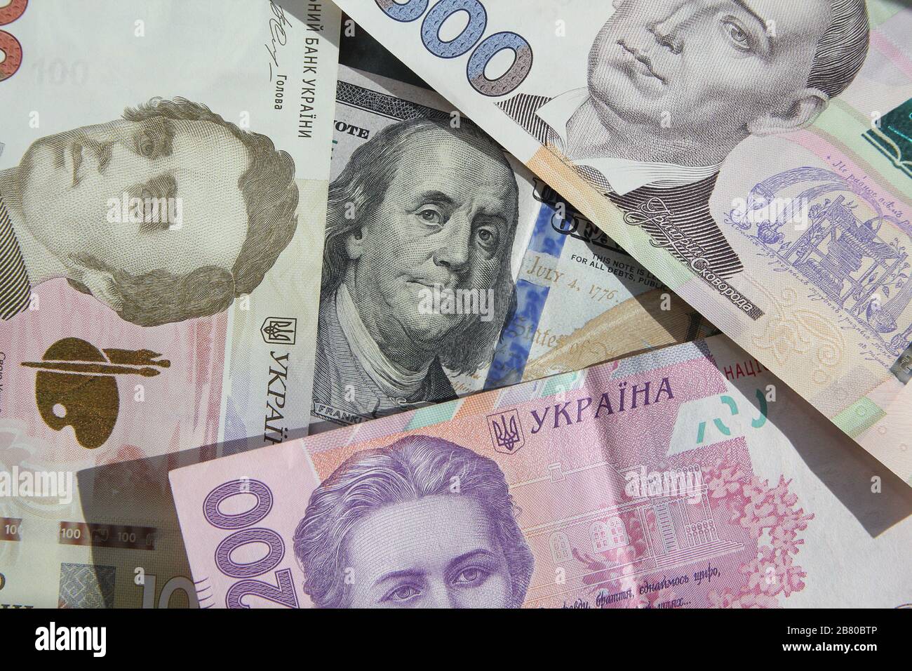 Ukrainian money - hryvnia banknotes USA dollars bills. Finance in Ukraine, of the hryvnia to the dollar exchange rate Stock Photo