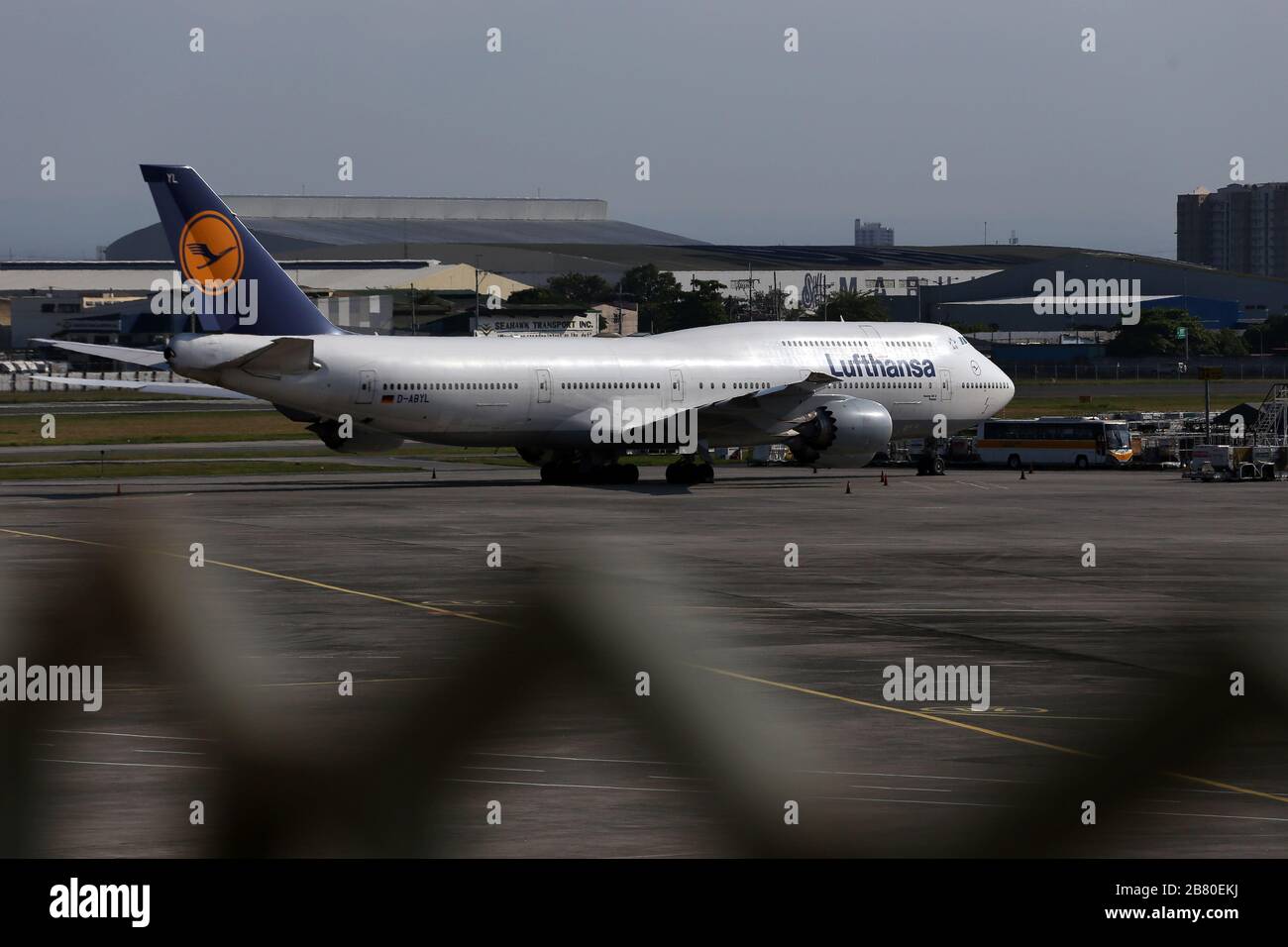 Manila, Philippines. 19th Mar, 2020. A Lufthansa plane is parked at the airport. More than 300 Germans are waiting at Ninoy Aquino International Airport for a Lufthansa flight chartered by the German Embassy in the Philippines because of the Covid 19 pandemic. Credit: Alejandro Ernesto//Alejandro Ernesto/DPA/Alamy Live News Stock Photo