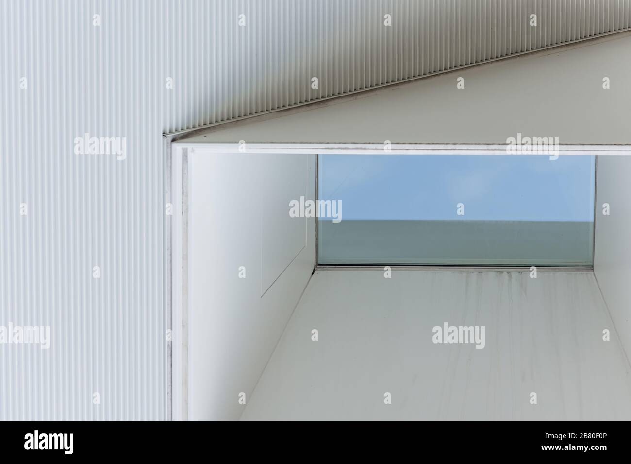 One window on a white wall Stock Photo