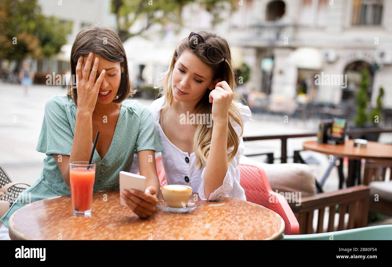 Desperate woman getting support from her best friend Stock Photo