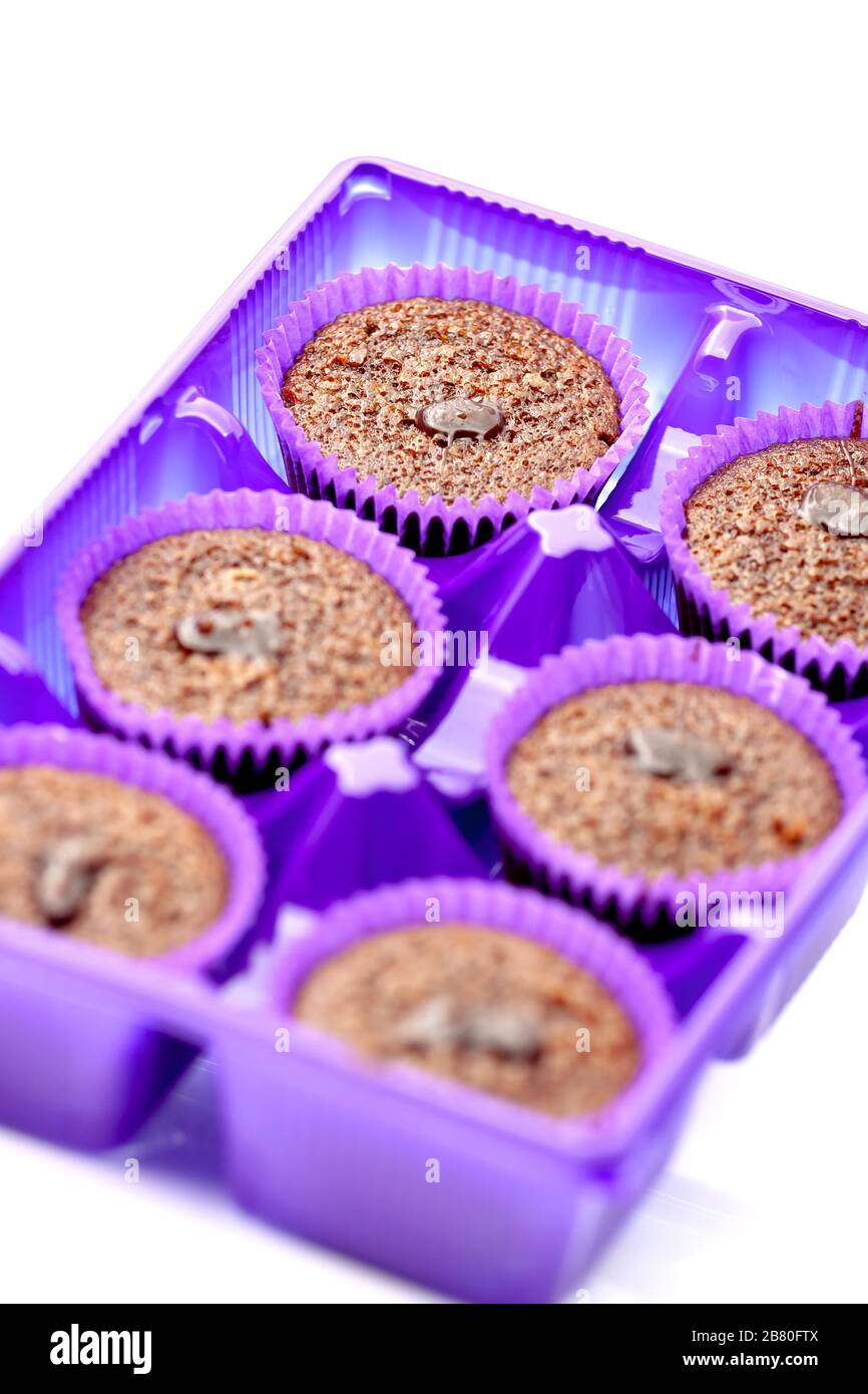 Chocolate muffins in a purple paper basket. Selective focus with shallow depth of field. Stock Photo