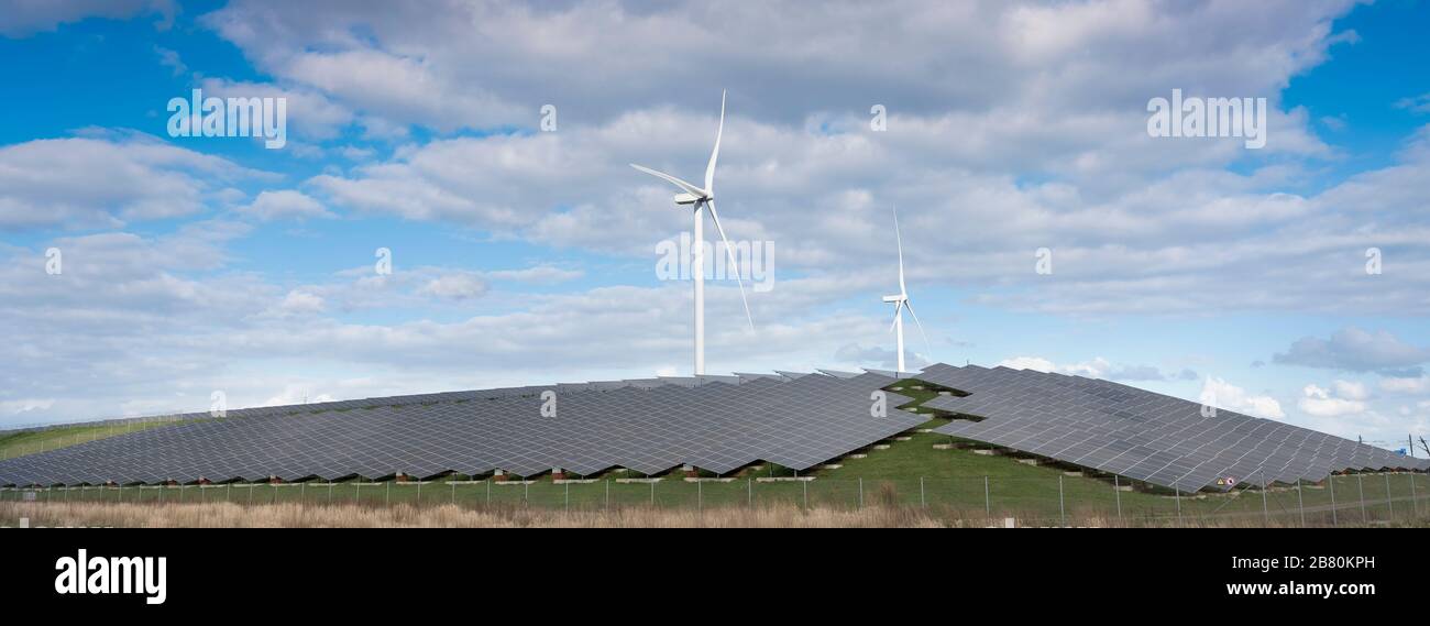 wind turbines and solar panels form alternative enery plant close ...