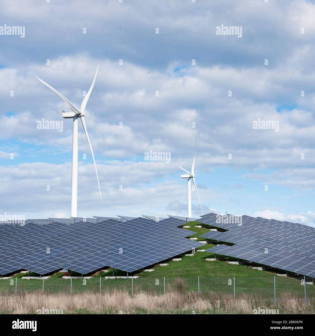 wind turbines and solar panels form alternative enery plant close ...