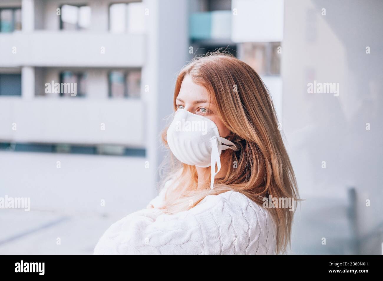 young woman wearing a face mask FFP3 Stock Photo