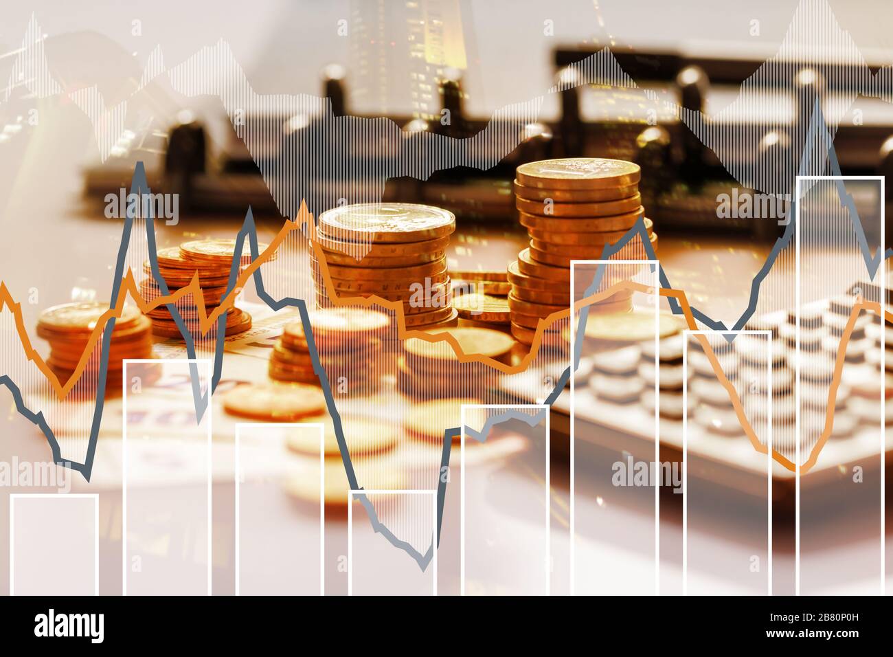 Euro coins in pile on Euro banknotes with calculator and charts, for background. Germany Stock Photo