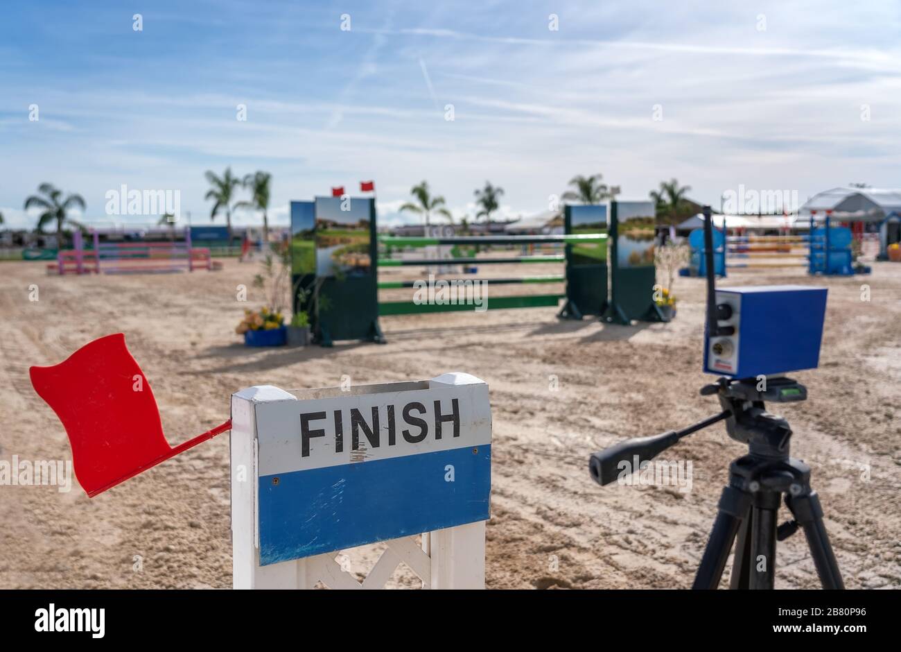 A device with a red flag for registering the finish line in equestrian racing at the racetrack Stock Photo