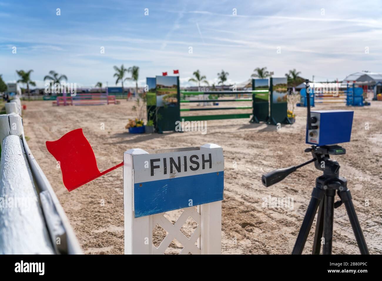 A device with a red flag for registering the finish line in equestrian racing at the racetrack Stock Photo