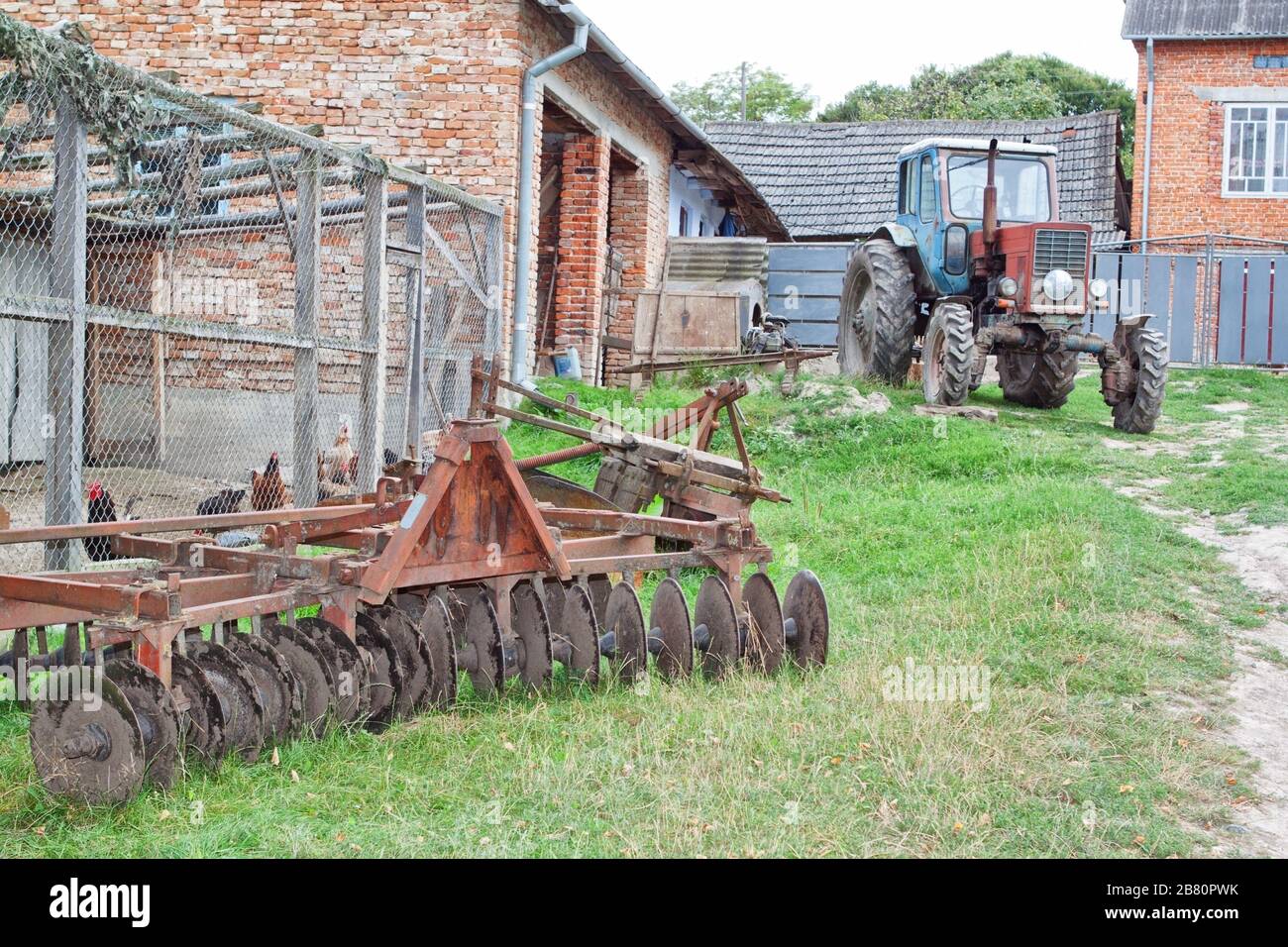 Antique tractor and plow on the farm Stock Photo - Alamy