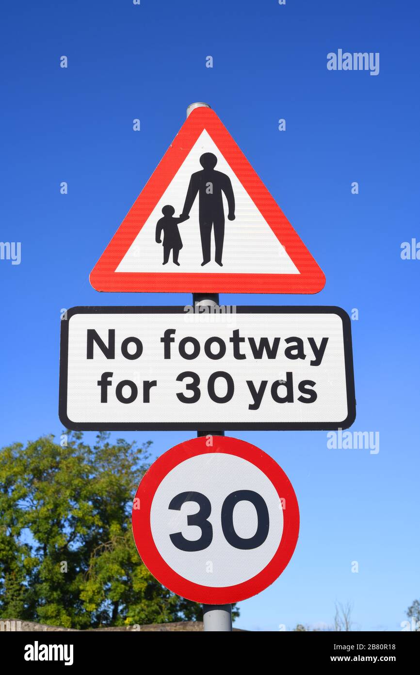no footway for pedestrians in road ahead warning sign on bridge crossing the river derwent at sutton on derwent united kingdom Stock Photo