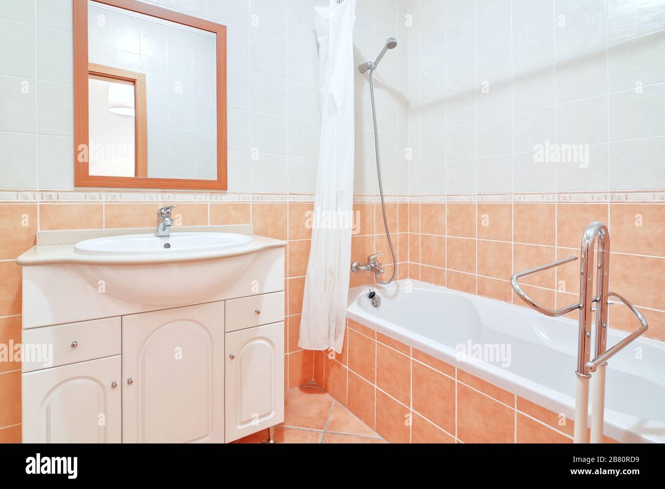 Bathroom with shower in orange Stock Photo Alamy