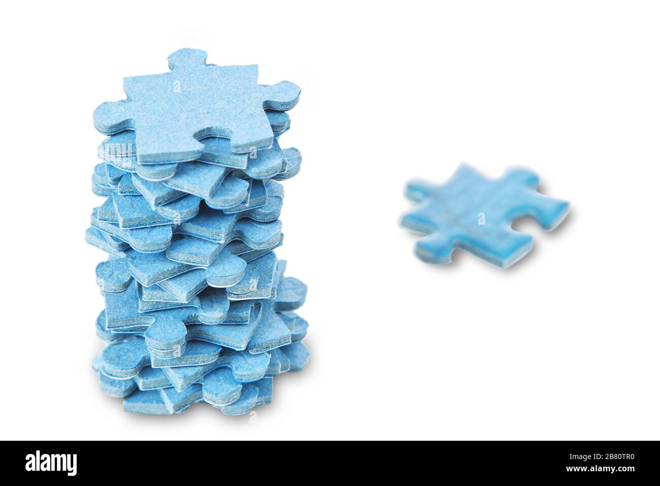 A stack of puzzles on a white background Stock Photo Alamy