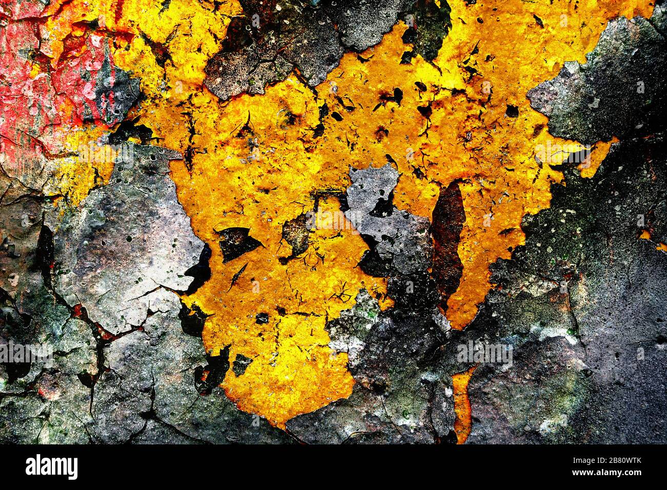 Surface texture with gray and yellow color on a cracked surface structure on which the paint peels off. For abstract backgrounds. Germany Stock Photo