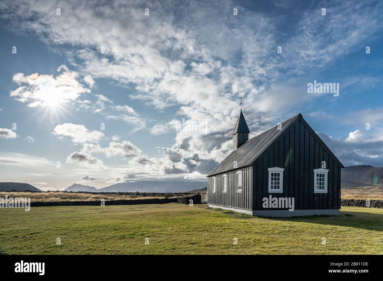 lonesome black church of Budir at the south coast of Snaefellsness peninsula in western Iceland Stock Photo